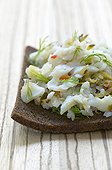 Slice of bread with cold fish with the relish France  