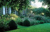 Flower bed near a house in La Pellerine garden France