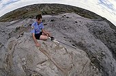 Guard in front of an Hadrosaur skeleton ; Dinosaur Provincial Park, Canada