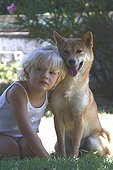 Girl sat with a Shiba Inu France 