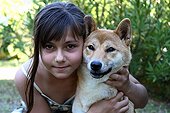 Portrait of a young girl and a Shiba Inu France 