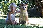 Girl sat with a Shiba Inu France 
