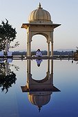 Tourist doing yoga at the spa pool of Udaivilâs Oberoi Hotel