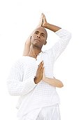 Woman and man praticing yoga on a beach in Martinique Island
