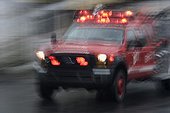 Ambulance traveling at high speed in the city Quito Ecuador  ; Photo taken in slow speed. Effect of movement. 
