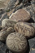 Stones engraved of mantra in Zangla Village India ; The mantra is an object or support of meditation. The inscribed on these stones is: om mane padme hum. <br>