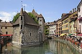 Palais de l'Isle in the old town of Annecy France ; Palais de l'Isle is a castle in the center of the Thiou a canal in Annecy. It was built in 1132. The Palais de l'Ile was classified as a Historical Monument in 1900, and today houses a local history museum.