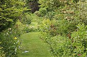 Driveway lined with flower Massif Le Jardin des Lianes ; Le jardin des lianes