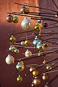Artificial Christmas tree with balls on a garden terrace