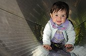 Girl playing in a park in Montbeliard France Doubs ; The girl was aged 13 months 
