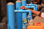 Boy filling his water bottle drinking Burma ; Taps the city's public