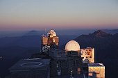Observatoire du Pic du Midi and its shadow in the mist