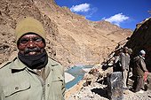 Workers of a road construction site in the valley Lung na India ; The man comes from southern India to work on this site