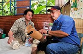 A lower limb prosthesis being fitted for a leprosy patient by an employee of the Deutsche Lepra- und Tuberkulosehilfe relief organisation, DAHW, at the leper colony in Agua de Dios, Colombia, South America