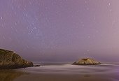 Beach and rock under the stars on the Cantabrian sea  Spain