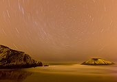 Beach and rock under the stars on the Cantabrian sea  Spain