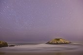 Beach and rock under the stars on the Cantabrian sea  Spain