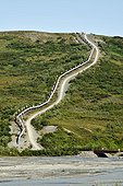 Trans-Alaska oil pipeline in the tundra Alaska USA  ; 800 miles from the Arctic Ocean (Prudhoe Bay - Valdez) through several major earthquake faults: dampers and slide rails can absorb the seismic waves and landslides 