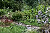 Japanese path in a flowered garden