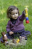 Girl and Easter chocolate in a nest - France 