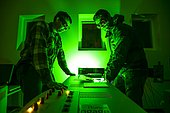 Preparation of a Lidar laser at Maïdo,Observatoire de Physique de l'Atmosphère de la Réunion (OPAR). Reunion Island. Guillaume Payen, OPAR's technical manager, and Nicolas Marquestaut, research engineer, prepare the lasers for the night's shooting. These lidar lasers are designed to analyze certain components of the atmosphere. The Maïdo atmospheric observatory on La Réunion (one of the 3 measurement sites of the OPAR (Observatoire de Physique de l'Atmosphère de La Réunion), has been installed since October 2012 on the Piton Maïdo at an altitude of 2,200 meters. The laboratory is equipped with active and passive remote sensing instrumentation, enabling long-term, high-quality measurements of the vertical profiles of numerous climatic variables. It enables us to monitor atmospheric and climatic parameters in a context of accelerating climate change, and benefits from a unique situation in the tropical southern hemisphere, where observations are extremely rare. The observatory has 4 laser lidars, 2 of which are visible (green), and 2 invisible to the human eye. Three of the lidars are fired vertically, and one at 45 degrees, to measure wind. (i) One lidar is dedicated to measuring water vapour, with a large 1.20 m diameter telescope and two paired lasers. (ii) Three other LIDARS are designed to measure vertical profiles of atmospheric parameters (including one fired at 45 degrees, for wind measurements). The Maido observatory benefits from several major advantages. (1) Its latitudinal position for studying stratospheric transport processes. (2) Its altitude, free from pollution, humidity and light, considerably improves the quality of remote sensing measurements for studying the chemical composition of the atmosphere. OPAR's observations are part of several international observation networks, including NDACC (Network for the Detection of Atmospheric Composition Changes) and GAW (Global Atmospheric Watching).
