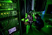 Preparation of a Lidar laser at Maïdo,Observatoire de Physique de l'Atmosphère de la Réunion (OPAR). Reunion Island. Guillaume Payen, OPAR's technical manager, and Nicolas Marquestaut, research engineer, prepare the lasers for the night's shooting. These lidar lasers are designed to analyze certain components of the atmosphere. The Maïdo atmospheric observatory on La Réunion (one of the 3 measurement sites of the OPAR (Observatoire de Physique de l'Atmosphère de La Réunion), has been installed since October 2012 on the Piton Maïdo at an altitude of 2,200 meters. The laboratory is equipped with active and passive remote sensing instrumentation, enabling long-term, high-quality measurements of the vertical profiles of numerous climatic variables. It enables us to monitor atmospheric and climatic parameters in a context of accelerating climate change, and benefits from a unique situation in the tropical southern hemisphere, where observations are extremely rare. The observatory has 4 laser lidars, 2 of which are visible (green), and 2 invisible to the human eye. Three of the lidars are fired vertically, and one at 45 degrees, to measure wind. (i) One lidar is dedicated to measuring water vapour, with a large 1.20 m diameter telescope and two paired lasers. (ii) Three other LIDARS are designed to measure vertical profiles of atmospheric parameters (including one fired at 45 degrees, for wind measurements). The Maido observatory benefits from several major advantages. (1) Its latitudinal position for studying stratospheric transport processes. (2) Its altitude, free from pollution, humidity and light, considerably improves the quality of remote sensing measurements for studying the chemical composition of the atmosphere. OPAR's observations are part of several international observation networks, including NDACC (Network for the Detection of Atmospheric Composition Changes) and GAW (Global Atmospheric Watching).