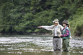 Guide to Fishing and Young Woman in Apprenticeship,, Fly fishermen on the French-Swiss Doubs river, La Goule, Franche-Comté, France