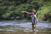 Young Woman fishing, Fly fishermen on the French-Swiss Doubs river, La Goule, Franche-Comté, France