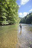 Young Woman fishing, Fly fishermen on the French-Swiss Doubs river, La Goule, Franche-Comté, France