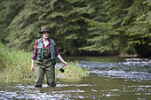 Young Woman fishing, Fly fishermen on the French-Swiss Doubs river, La Goule, Franche-Comté, France
