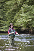 Young Woman fishing, Fly fishermen on the French-Swiss Doubs river, La Goule, Franche-Comté, France