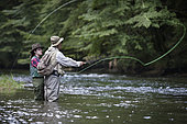 Guide to Fishing and Young Woman in Apprenticeship,, Fly fishermen on the French-Swiss Doubs river, La Goule, Franche-Comté, France