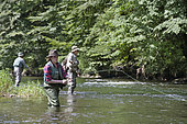 Fly fishermen on the French-Swiss Doubs river, La Goule, Franche-Comté, France