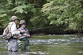 Guide to Fishing and Young Woman in Apprenticeship,, Fly fishermen on the French-Swiss Doubs river, La Goule, Franche-Comté, France