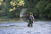Young Woman, Fly fishermen on the French-Swiss Doubs river, La Goule, Franche-Comté, France