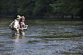 Guide to Fishing and Young Woman in Apprenticeship,, Fly fishermen on the French-Swiss Doubs river, La Goule, Franche-Comté, France