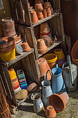 Stored terracotta pots and traditional watering cans, Provence, France