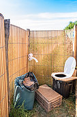Temporary dry toilet system in a garden party, summer, Alsace, France