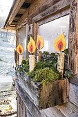 Decoration "Candles" painted on a birch branch in winter, Lorraine, France
