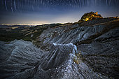 Startrail on the badlands nearn the Canossa Castle, Luzzara, Reggio Emilia, Italy