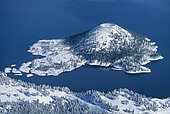 Wizard Island and Crater Lake in winter snow; Crater Lake National Park, Oregon, USA.