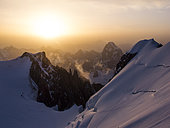 Snowed alpine landscape in the Mont Blanc massif at sunrise