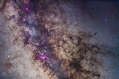 A mosaic of the region around the Small Sagittarius Starcloud and Dark Horse dark nebula complex. The field takes in the Milky Way from the Lagoon Nebula at bottom to the Eagle Nebula at top left. In between from top to bottom are the Swan Nebula (M17), and the Small Sagittarius Starcloud (M24). Flanking the bright M24 starcloud are the large open clusters M23 (right) and M25 (left). At bottom left is the M22 globular star cluster. The prominent dark nebula at right is the large Pipe Nebula (B78) with the small Snake Nebula (B72) above it. The whole complex is visible to the naked eye as the Dark Horse. This is a mosaic of 4 panels, each a stack of 5 x 3 minute exposures with the 135mm lens at f/2.8, and with the filter-modified Canon 5D Mark II at ISO 1600 tracking the sky on the iOptron SkyTracker, with no guidind. Images were stacked and stitched in Photoshop CC. Taken from the Four Bar Cottages near Portal Arizona, May 4/5, 2014.