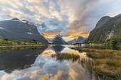 Mitre Peak reflecting in the water, sunset, Milford Sound, Fiordland National Park, Te Anau, Southland Region, Southland, New Zealand, Oceania