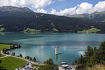 Bell tower of Curon (Graun), at Resia Lake, at dusk, Trentino-Alto Adige, Italy