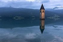 Bell tower of Curon (Graun), at Resia Lake, at dusk, Trentino-Alto Adige, Italy
