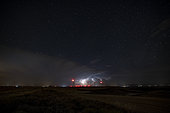 Isolated thunderstorm on a starry night. Thunderstorm coming from the Iberian mountains at the end of the day and heading to the Pyrenees in the night of July 12, 2020 under a starry sky. Spain