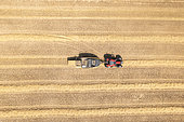 Making straw bales with a hay press in summer, Opal Coast, Pas de Calais, France