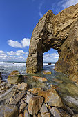 Granite arch of Port Blanc, emblem of the Côte Sauvage de Quiberon, Hercynian granite eroded by the sea, Brittany, France