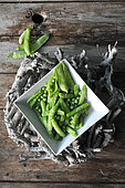 Sugar peas and Garden peas (Pisum sativum) in a dish, harvested from the garden